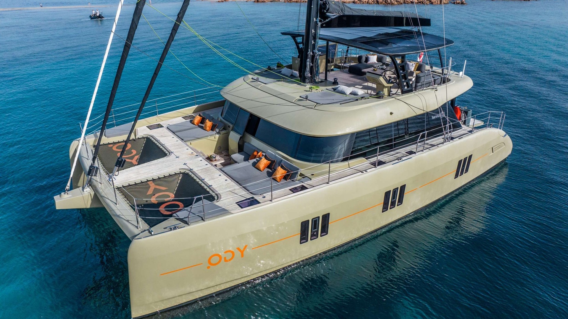 Sleek catamaran sailing on calm waters.